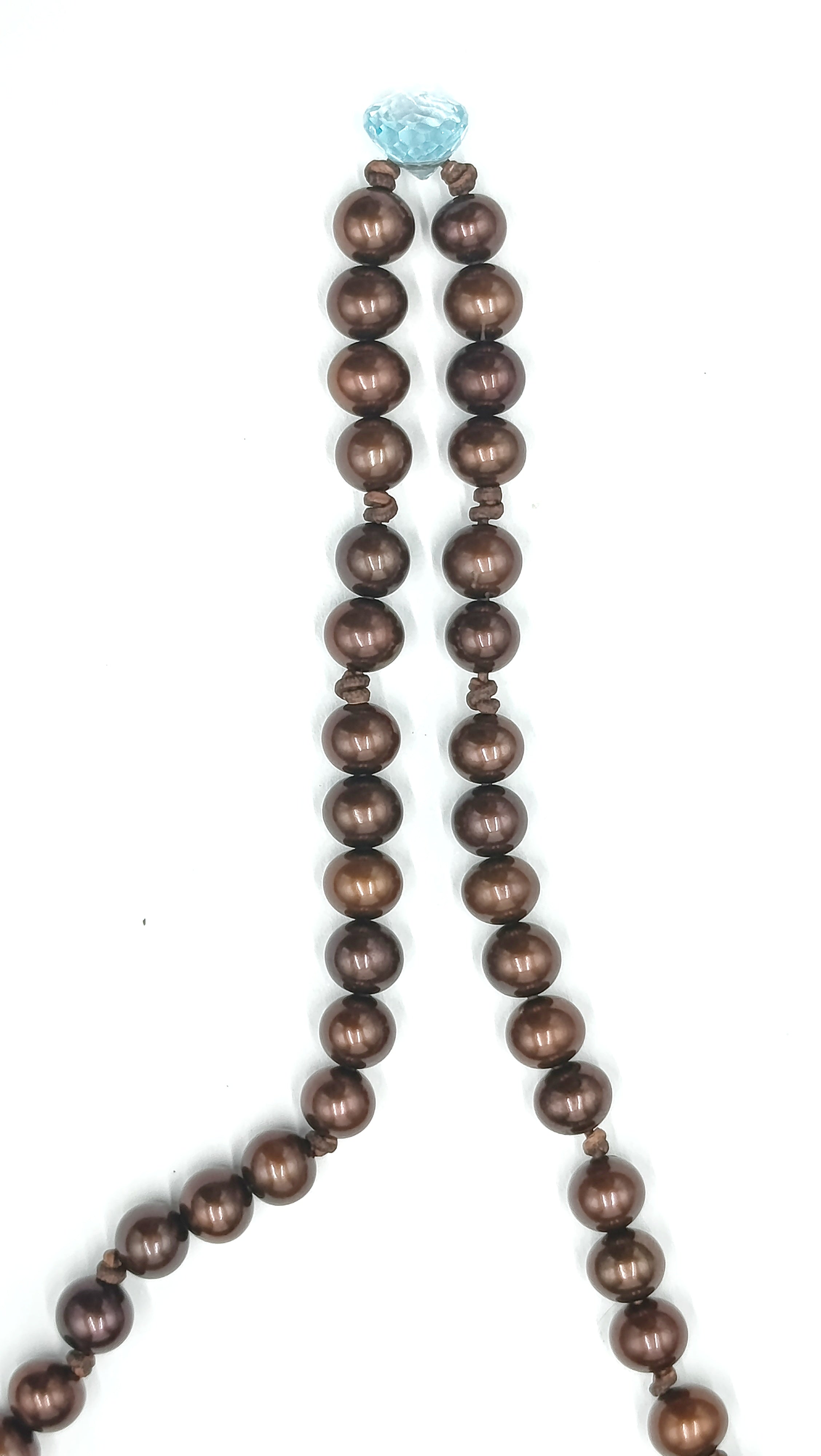 Nara en Perla Marrón con Topacio en cuero natural